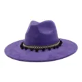 Purple felt jazz hat detail showcasing ethnic style woven band and cute black pom-pom trim. - Deep purple