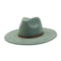 Detailed shot of sage green suede fedora hat with brown geometric patterned band, classic wide brim design. - M (56-58cm) / Olive Green