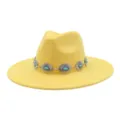 Close-up detail of yellow suede fedora hat with vintage silver concho turquoise band. - 58cm / Bright yellow