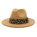 Close-up detail of the camel fedora hat featuring a stylish leopard print band, woolen texture. - Camel
