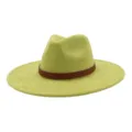 Close-up detail of light green suede fedora hat featuring a stylish brown patterned leather band. - 58cm / Avocado Green