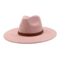 Close-up detail of the pink suede fedora hat featuring a brown patterned leather band. - 58cm / Dusty Pink