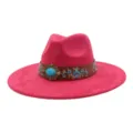 Detailed view of pink wide brim fedora hat with blue embroidery and turquoise metal buckle - Rose Red
