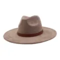 Detailed view of the stylish beige suede fedora hat featuring a patterned brown leather band. - 58cm / Dusty Pink