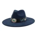 Detailed view of dark blue suede jazz hat featuring vintage floral embroidery and large silver buckle. - 58cm / Navy Blue