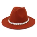 Detailed view of the elegant women wool fedora hat featuring delicate pearl beaded trim. - Rust Red