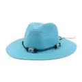 Blue straw sun hat detail with black cord and floral beads, casual summer beach wear accessory. - Lake Blue