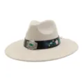 Beige suede flat brim jazz hat featuring embroidered black band and silver buckle detail. - 58cm / Beige
