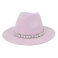 Close-up detail view of the pink felt fedora hat featuring an elegant pearl woven band trim. - Pink
