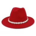 Detailed view of the red wool fedora hat featuring elegant pearl and bead trim band. - Red