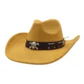 Close-up detail of a yellow suede cowboy hat featuring a skull metal band and wide brim. - Bright yellow