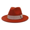 Gedetailleerd overzicht van de oranje wollen fedora hoed met mooie geweven band. - 58cm / Roestvrij Rood