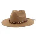 Close-up of a stylish straw fedora sun hat featuring a beaded braided band and wide brim. - Khaki