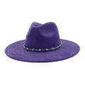 Close-up of a stylish purple faux suede fedora hat adorned with a silver turquoise chain. - 58cm / Deep purple