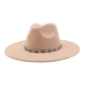 Detail view of beige felt fedora hat featuring a turquoise stone metal chain band. - 58cm / Champagne