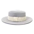 Grey straw boater hat with geometric woven ribbon band, close-up product detail view. - 58cm / Gray