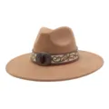 Detailed view of camel suede fedora hat with ethnic embroidery and vintage metal buckle. - 58cm / Camel