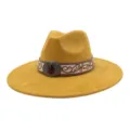 Detail shot of a mustard yellow suede fedora hat featuring an embroidered band with vintage metal buckle. - 58cm / Turmeric