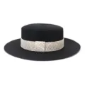Detailed view of the black flat-top straw hat featuring a stylish beige and white woven ribbon. - 58cm / Black
