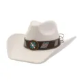 Close-up detail of the vintage western cowboy hat featuring decorative band and flower metal badge. - Cream