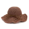 Detailed view of the brown straw hat, showing delicate woven texture and stylish bow tie string. - Dusty Pink