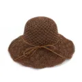 Detailed view of the brown crochet straw hat showing delicate woven texture and bow tie. - Dark Coffee