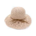 Close-up detail of the beige crochet straw hat featuring a wide hollow brim and a chic brown bow. - Pink