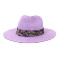 Close up detail of purple straw fedora hat featuring colorful paisley ribbon band decor. - Light Purple