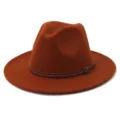 Close-up detail of the brown woolen fedora hat, featuring a stylish slim leather strap accent. - 58cm / Rust Red