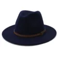 Detailed view of the dark blue felt fedora hat featuring a brown leather belt buckle accent. - 58cm / Navy Blue