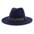 Close-up detail of navy blue wool fedora hat featuring ethnic floral woven band. - 58cm / Navy Blue