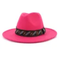 Detailed close-up view of a vibrant hot pink felt fedora hat with an ethnic woven band. - 58cm / Rose Red