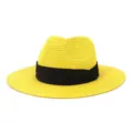 Detailed view of yellow straw fedora hat with black ribbon for summer beach sun protection. - 58cm / Yellow