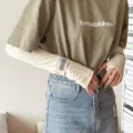 Detailed view of women's ice silk sun protection sleeves with trendy T-shirt matching summer style. - One Size / Beige