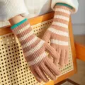 Warm knitted striped gloves for women, long design with cozy wool material and stylish cuffs. - One Size / Coffee