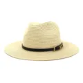 Detailed view of the women's straw sun hat texture, featuring a black belt and metal buckle decor. - 58cm / Beige