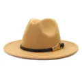 Detailed close-up of the elegant camel wool fedora hat with black belt and gold buckle design. - Camel
