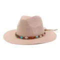 Chapeau de paille tressé avec bande de perles colorées et large bord pour plage d'été. - Rose