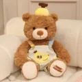 Cute brown teddy bear plush toy with banana hat and overalls, soft doll gift for kids. - 25cm / Banana Suspender Style