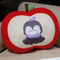 Cute red apple plush pillow with cartoon penguin print, soft sofa cushion and chair backrest. - Penguin