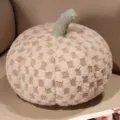 Plush pumpkin throw pillow with cozy fleece fabric, cute checkered design, ideal for home decor. - Coffee