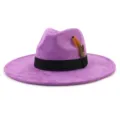 Detailed view of women's faux suede fedoras hat featuring a chic black band and decorative feather. - M (56-58cm) / Deep purple