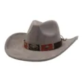 Close-up detail of grey suede western cowboy hat with brown leather band and metal bull skull. - Charcoal Grey