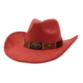 Detail shot of the red suede cowboy hat featuring a brown decorative band with bull skull emblem. - Rust red