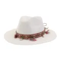 Close-up of the stylish woven ethnic band, decorative tassels, and natural seashell accents. - White