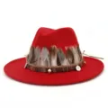 Detailed view of red felt fedora hat with feather decor and vintage coin charms for women. - 58cm / Red