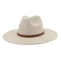 Close-up detail of beige suede fedora hat with brown studded leather band stylish accessory. - 58cm / Beige