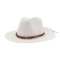 Detailed view of a white straw sun hat featuring a colorful beaded band and leather string accent. - White