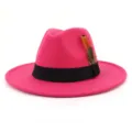 Close up detail view of pink wool felt fedora hat with black band and feather decor. - 58cm / Rose Red