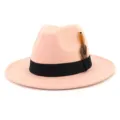 Close-up detail of the elegant pink felt fedora hat with black ribbon and chic feather. - 58cm / Dusty Pink